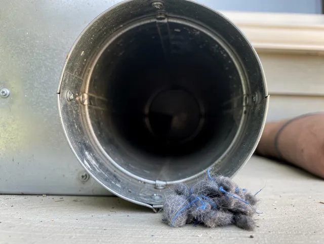 Fountain Valley Dryer Vent Cleaning technician using specialized equipment to clear severe dryer vent blockage in Fountain Valley